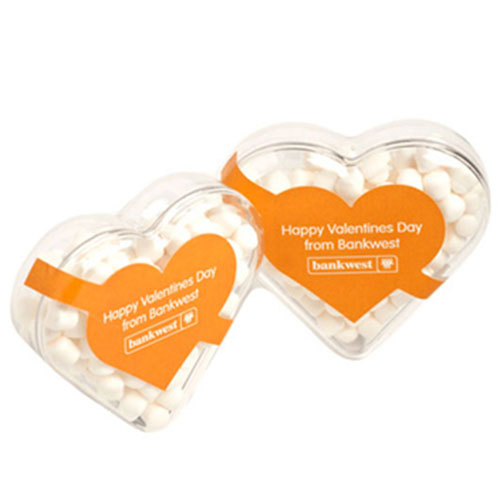 Acrylic Heart Container With Chewy Mints 50g CACC030C Branded Front View Acrylic Heart Container With Chewy Mints 50g CACC030C Branded Front View
